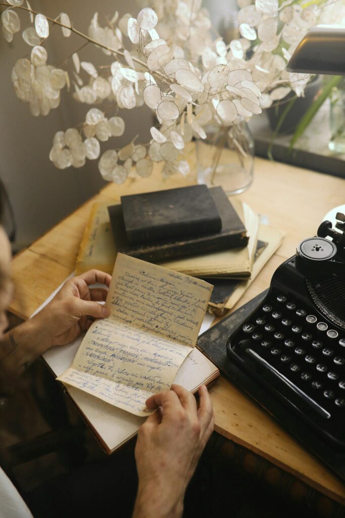 A serene scene featuring a vintage typewriter and handwritten journal on a cozy wooden desk.